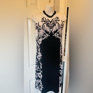 Beautiful dress-- brand new . The size is xs and fits like a small